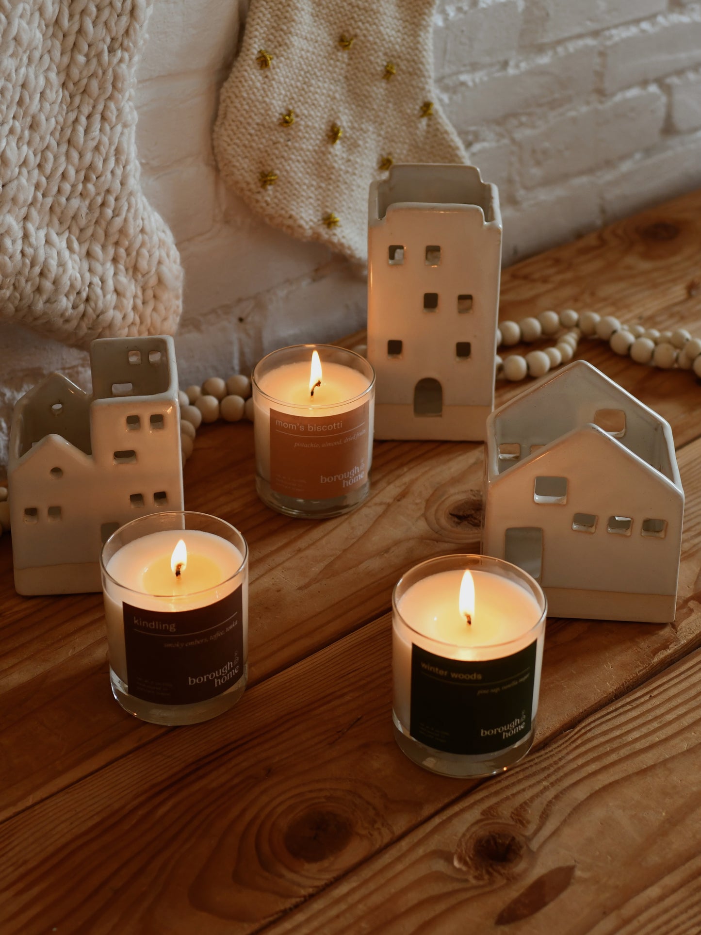 Winter Candle Collection, a trio of candles that are burning with holiday decor